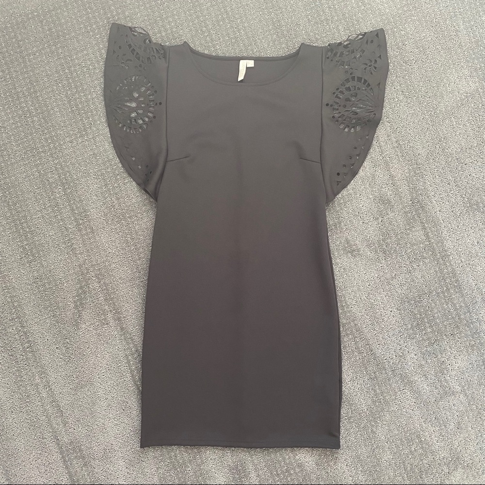 Black dress with ornate sleeves